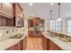 Well-equipped kitchen with granite countertops, stainless steel appliances, and custom cabinets at 255 Beech Tree Holw, Sugar Hill, GA 30518
