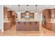 Gourmet kitchen with custom cabinetry, granite countertops, and stainless steel appliances at 255 Beech Tree Holw, Sugar Hill, GA 30518