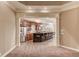 Open kitchen features stainless steel appliances, granite countertops, and a breakfast bar with seating at 255 Beech Tree Holw, Sugar Hill, GA 30518