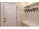 Functional mudroom with coat hooks, storage, and convenient access to the home at 255 Beech Tree Holw, Sugar Hill, GA 30518