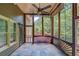 Screened-in porch with a ceiling fan and views of the surrounding trees and greenery at 255 Beech Tree Holw, Sugar Hill, GA 30518