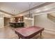 Open rec room with bar seating and granite counters, perfect for entertaining at 255 Beech Tree Holw, Sugar Hill, GA 30518