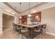 Stylish wet bar with seating, granite countertops, and stainless steel appliances at 255 Beech Tree Holw, Sugar Hill, GA 30518