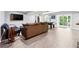 Spacious finished basement with modern vinyl floors, a pool table, and a comfortable seating area at 3248 Wildwood Sw Dr, Marietta, GA 30060