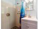 Clean bathroom featuring a shower, sink, light blue walls, and a patterned shower curtain at 3248 Wildwood Sw Dr, Marietta, GA 30060