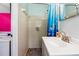 Cozy bathroom with a shower, sink, and patterned shower curtain that complements the surrounding decor at 3248 Wildwood Sw Dr, Marietta, GA 30060