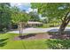 Well-maintained front yard leading to a charming single-story home with covered parking at 3248 Wildwood Sw Dr, Marietta, GA 30060