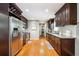 Galley kitchen featuring stainless steel appliances, granite countertops, and abundant cabinet space at 3248 Wildwood Sw Dr, Marietta, GA 30060