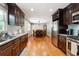 Spacious kitchen featuring granite countertops, stainless steel appliances, and a view of the dining area at 3248 Wildwood Sw Dr, Marietta, GA 30060