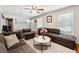 Inviting living room featuring hardwood floors, a sectional sofa, and natural light at 3248 Wildwood Sw Dr, Marietta, GA 30060