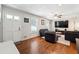 Bright living room featuring hardwood floors, neutral walls, and contemporary furnishings at 3248 Wildwood Sw Dr, Marietta, GA 30060