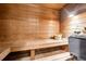 Inviting wooden sauna with bench seating and traditional sauna accessories for a relaxing experience at 3248 Wildwood Sw Dr, Marietta, GA 30060