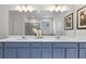 Bathroom featuring a double vanity with white countertops and blue cabinets at 4011 Fallen Leaf Ct, Kennesaw, GA 30152