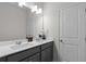 Bathroom with double sink vanity, large mirror, and white countertops at 4011 Fallen Leaf Ct, Kennesaw, GA 30152