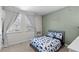 Cozy bedroom features two windows, blue accents and carpeted floors at 4011 Fallen Leaf Ct, Kennesaw, GA 30152