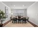 Stylish dining room with modern decor, neutral colors, and hardwood floors, perfect for entertaining at 4011 Fallen Leaf Ct, Kennesaw, GA 30152
