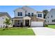 Charming two-story home featuring a stone facade, white siding, and an attached two-car garage at 4011 Fallen Leaf Ct, Kennesaw, GA 30152