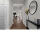 Inviting foyer with hardwood floors, elegant decor, and views into the living spaces at 4011 Fallen Leaf Ct, Kennesaw, GA 30152