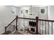 Bright foyer with staircase showcasing wrought iron spindles overlooking the living area at 4011 Fallen Leaf Ct, Kennesaw, GA 30152