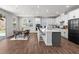 Bright, modern kitchen with white cabinets, dark accents, and sliding glass doors to outdoor area at 4011 Fallen Leaf Ct, Kennesaw, GA 30152