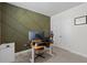 Office with a custom accent wall, multiple computer monitors and carpeted floor at 4011 Fallen Leaf Ct, Kennesaw, GA 30152