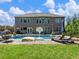Inviting backyard pool area with lounge chairs, a basketball hoop, and ample seating at 5220 Southern Hills Ln, Cumming, GA 30040