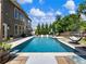 A picturesque backyard pool featuring a sparkling pool and poolside lounge furniture at 5220 Southern Hills Ln, Cumming, GA 30040