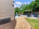Backyard pool and patio with nice seating, and beautiful landscaping surrounding the yard at 5220 Southern Hills Ln, Cumming, GA 30040