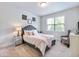 Serene bedroom with a plush bed, soft lighting, and a calming color palette at 5220 Southern Hills Ln, Cumming, GA 30040