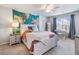 Bedroom featuring a light wood bed frame, a map wall hanging, and a ceiling fan at 5220 Southern Hills Ln, Cumming, GA 30040