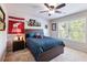 Bedroom with a ceiling fan, pennant, and natural light at 5220 Southern Hills Ln, Cumming, GA 30040