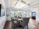 Well-lit dining room with coffered ceilings, and a set dining table at 5220 Southern Hills Ln, Cumming, GA 30040