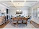 Elegant dining room with coffered ceilings, chandelier, and a set dining table at 5220 Southern Hills Ln, Cumming, GA 30040