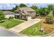 Beautiful exterior of a two-story home with a long driveway and lush green lawn at 5220 Southern Hills Ln, Cumming, GA 30040