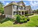Two-story home with brick and siding, dark shutters, and a well-manicured lawn at 5220 Southern Hills Ln, Cumming, GA 30040