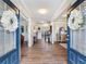 Grand foyer with hardwood floors, high ceilings, and elegant decor at 5220 Southern Hills Ln, Cumming, GA 30040