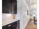 Hallway with wainscoting and view of dining room at 5220 Southern Hills Ln, Cumming, GA 30040
