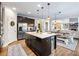 Modern kitchen with a center island, stainless steel appliances, and an open floor plan at 5220 Southern Hills Ln, Cumming, GA 30040