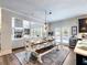 Eat-in kitchen with large island, stainless beverage cooler and view of the living room at 5220 Southern Hills Ln, Cumming, GA 30040