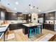 Stylish kitchen with dark cabinets, stainless steel appliances, and a bright, airy design at 5220 Southern Hills Ln, Cumming, GA 30040
