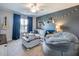 Cozy living room with a large beanbag, sectional couch, and decorative shelving at 5220 Southern Hills Ln, Cumming, GA 30040