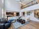 Spacious living room with hardwood floors, high ceilings, and staircase to the upper level at 5220 Southern Hills Ln, Cumming, GA 30040