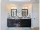 Elegant main bathroom with double vanity, granite countertops, decorative mirrors, and modern fixtures at 5220 Southern Hills Ln, Cumming, GA 30040