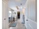Luxurious bathroom featuring a glass-enclosed shower, soaking tub, and access to a large walk-in closet at 5220 Southern Hills Ln, Cumming, GA 30040
