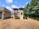 Playground with climbing structure, slide, and access to the community pool at 5220 Southern Hills Ln, Cumming, GA 30040