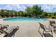 A large community pool with lounge chairs and tables in the community at 5220 Southern Hills Ln, Cumming, GA 30040