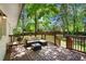 Inviting back deck with outdoor seating, perfect for enjoying the serene and lush backyard at 6090 Heritage Se Way, Mableton, GA 30126