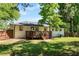 Expansive backyard with a wooden deck, offering plenty of space for outdoor activities and relaxation at 6090 Heritage Se Way, Mableton, GA 30126