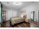 Inviting bedroom features a neutral color scheme, wood flooring, and ample closet space at 6090 Heritage Se Way, Mableton, GA 30126