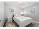 Bedroom with neutral decor, with a white bed and a decorative rug at 6090 Heritage Se Way, Mableton, GA 30126